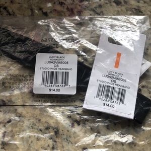 Lucy black one size headband..NEW IN PACKAGE